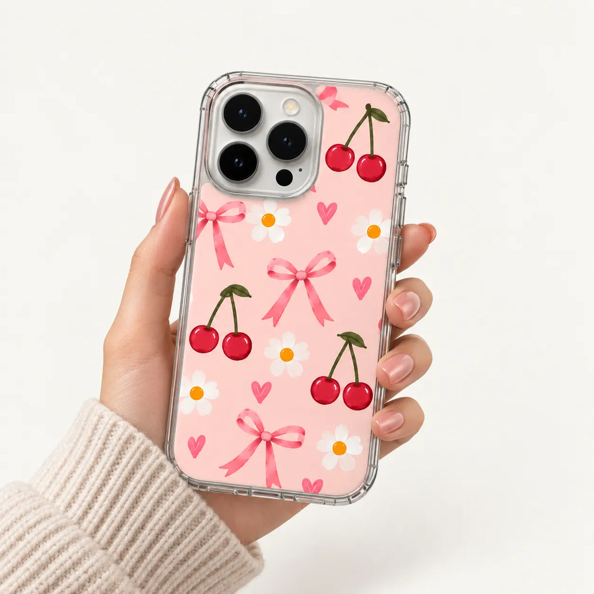 SLEEVER clear TPU phone case with red cherries, pink bows, and white daisy flowers pattern UV print with magnetic charging compatibility   