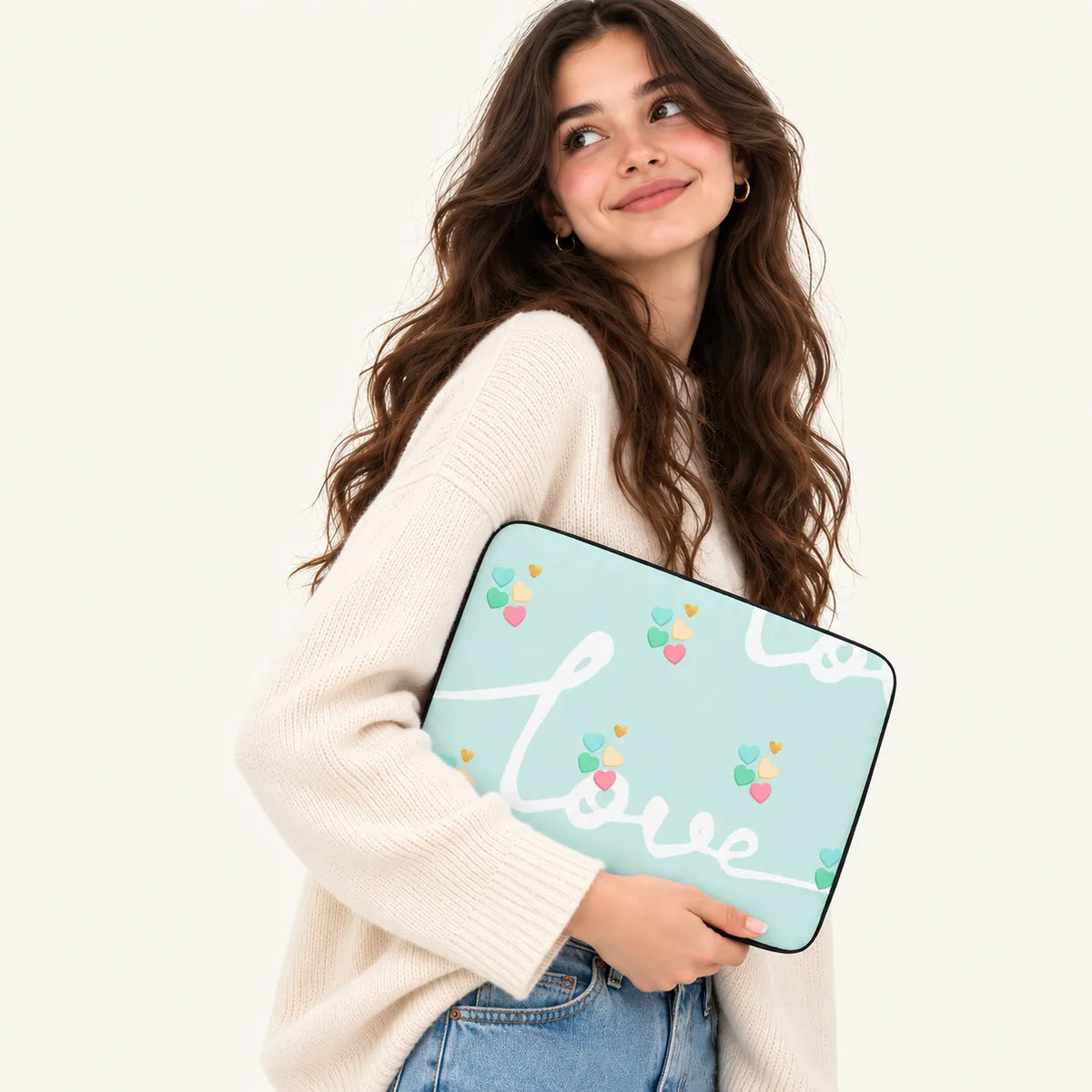Pastel mint green background with white Love typography and colorful tiny hearts on a padded laptop sleeve by SLEEVER