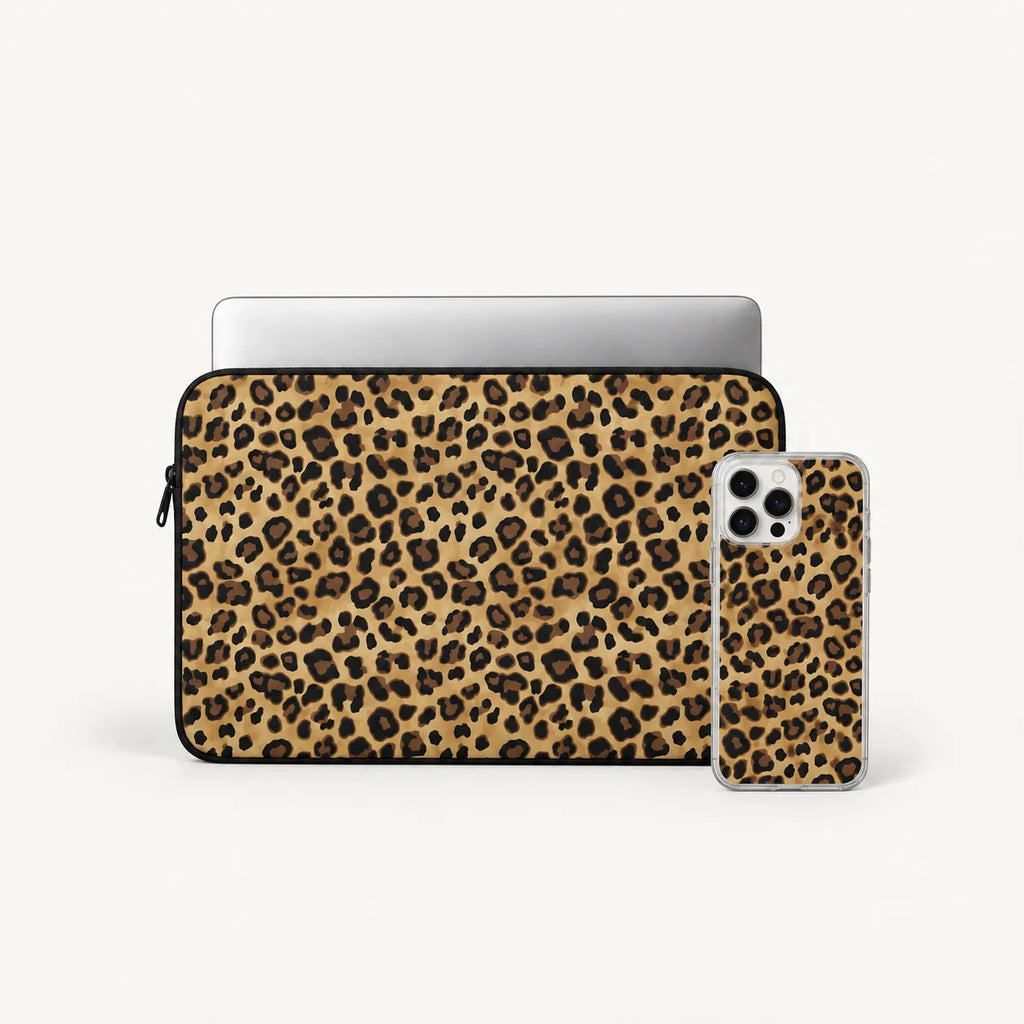 A laptop sleeve and a smartphone case, both featuring a leopard print pattern in tan, brown, and black, displayed on a clean off-white background. A silver laptop is shown inside the sleeve, and a smartphone is shown in the case.