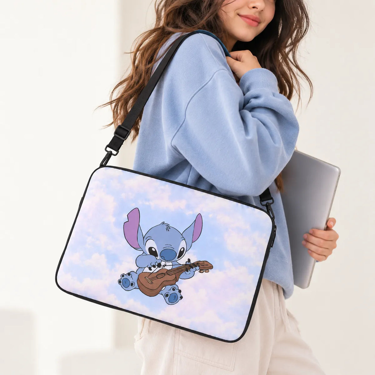 Cute Disney Stitch character playing ukulele on a fluffy pastel blue sky background on a padded laptop sleeve by SLEEVER