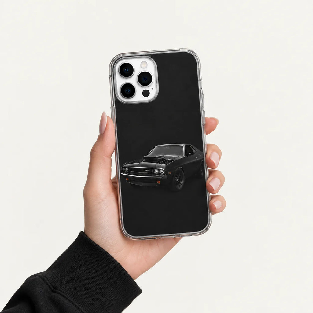 SLEEVER clear TPU phone case featuring a classic black Dodge Challenger muscle car UV print with magnetic charging support
