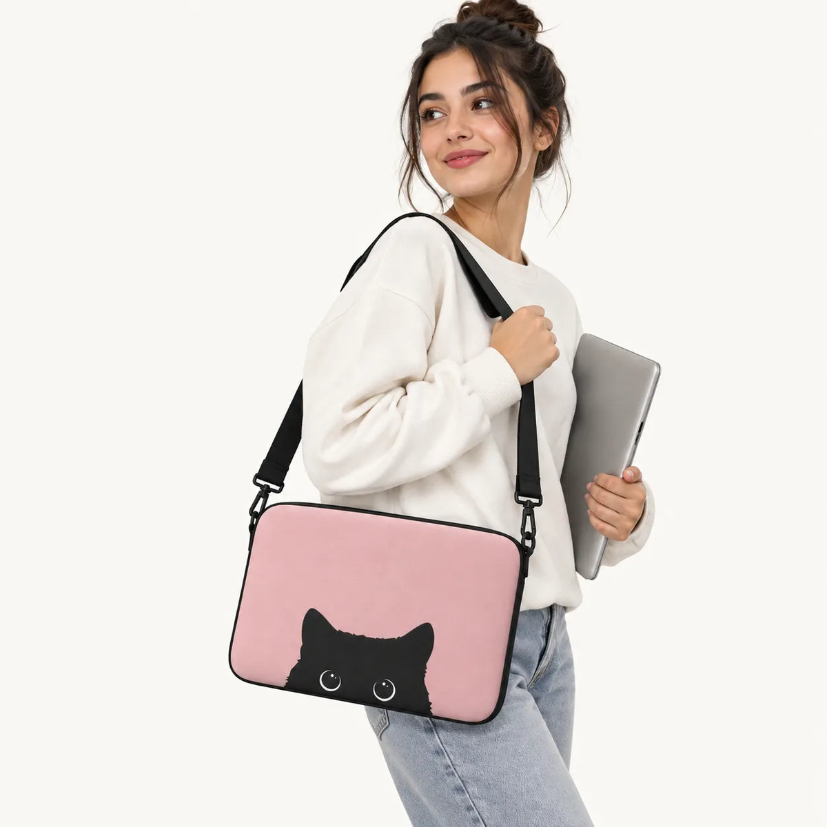 Cute black cat peeking from the bottom on a dusty pink padded laptop sleeve by SLEEVER