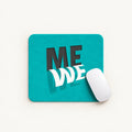 A square teal mouse pad with a 3D-effect graphic reading 'ME WE' in black and white, shown on a light beige background with a white computer mouse resting on the right side.