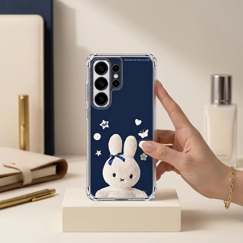 SLEEVER clear TPU phone case with cute white plush bunny graphic and navy blue bow UV print with magnetic charging compatibility   
