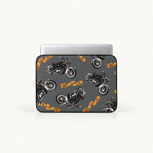 A laptop sleeve featuring a repeating pattern of black motorcycles and orange banners with the text 'Biker Club', shown on a light gray background with a silver laptop partially inserted.