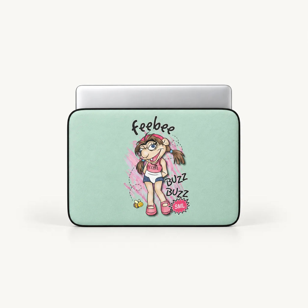 A laptop sleeve with a light mint green background and a colorful cartoon girl graphic, shown with a silver laptop partially inserted. The graphic includes the text 'Feebee' and 'BUZZ BUZZ BAIL!'.