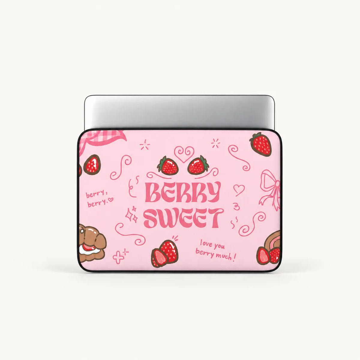 A laptop skin featuring a pink strawberry-themed design with the text 'BERRY SWEET' and doodles of strawberries, hearts, and bows, shown on a silver laptop against a light gray background.
