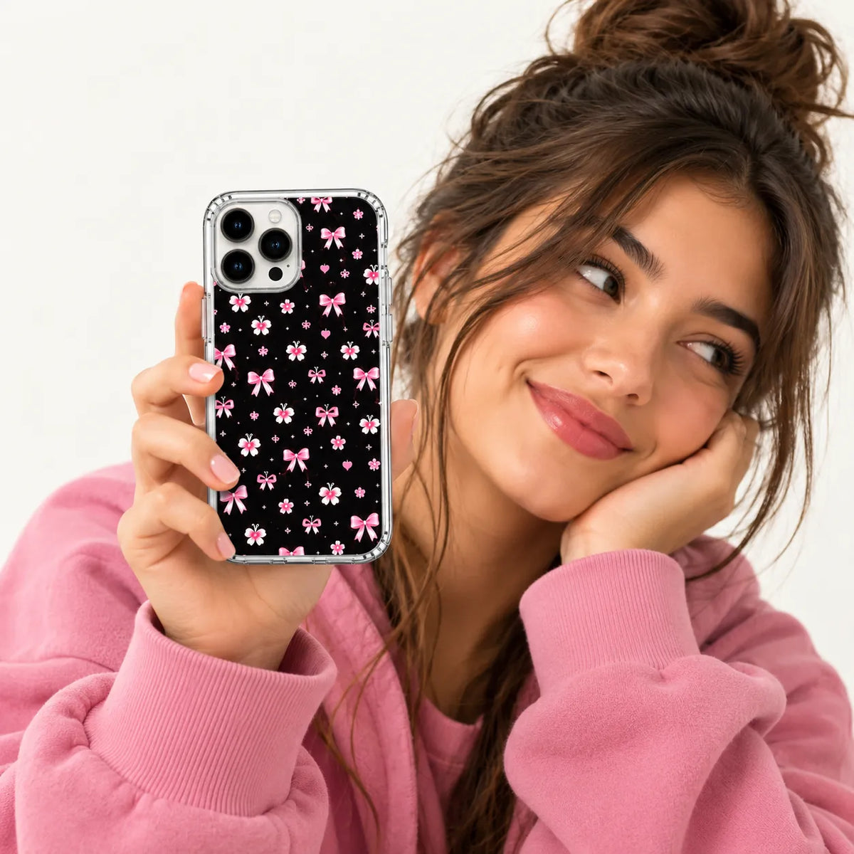 SLEEVER clear TPU phone case with pink ribbon bows, flowers, and tiny hearts pattern on black background UV print with magnetic charging compatibility