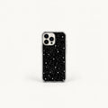 A clear phone case with a black printed back featuring a white star constellation pattern, shown on a silver iPhone against a clean white background.