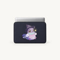 A dark navy laptop sleeve with a cute cartoon wizard pigeon graphic, shown on a light gray background.