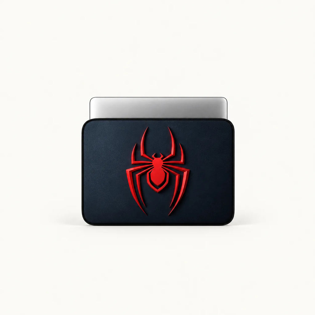 A black laptop sleeve featuring a prominent red spider logo on the front, shown with a silver laptop partially inserted, set against a clean off-white background.
