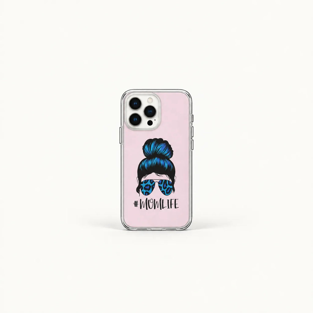 A clear phone case with a light pink back, featuring a graphic of a woman with blue hair in a bun and leopard-print sunglasses, with the text '#MOMLIFE' printed below. The case is shown on a white background.