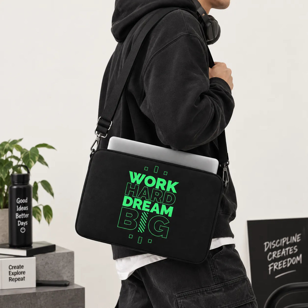 Neon green and outline typography reading Work Hard Dream Big on a black padded laptop sleeve by SLEEVER