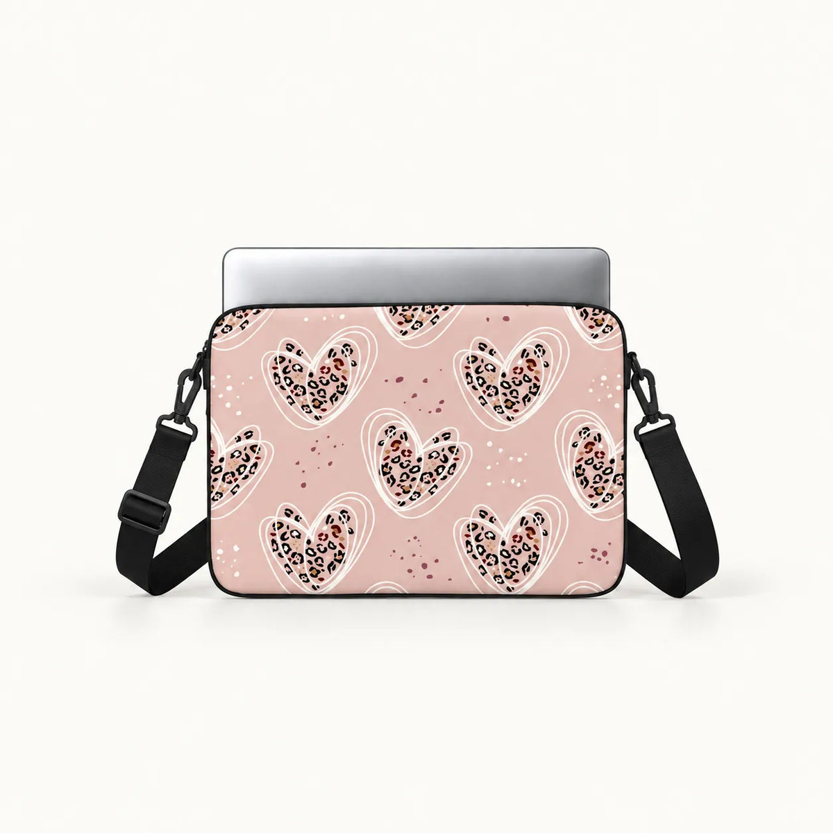 Dusty pink laptop sleeve printed with leopard pattern hearts encircled by white line art by SLEEVER