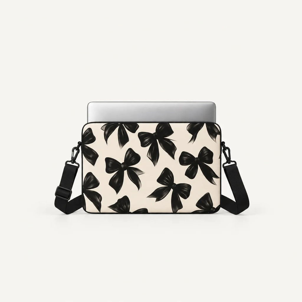 Elegantly painted black satin ribbon bows seamless pattern on beige padded laptop sleeve by SLEEVER