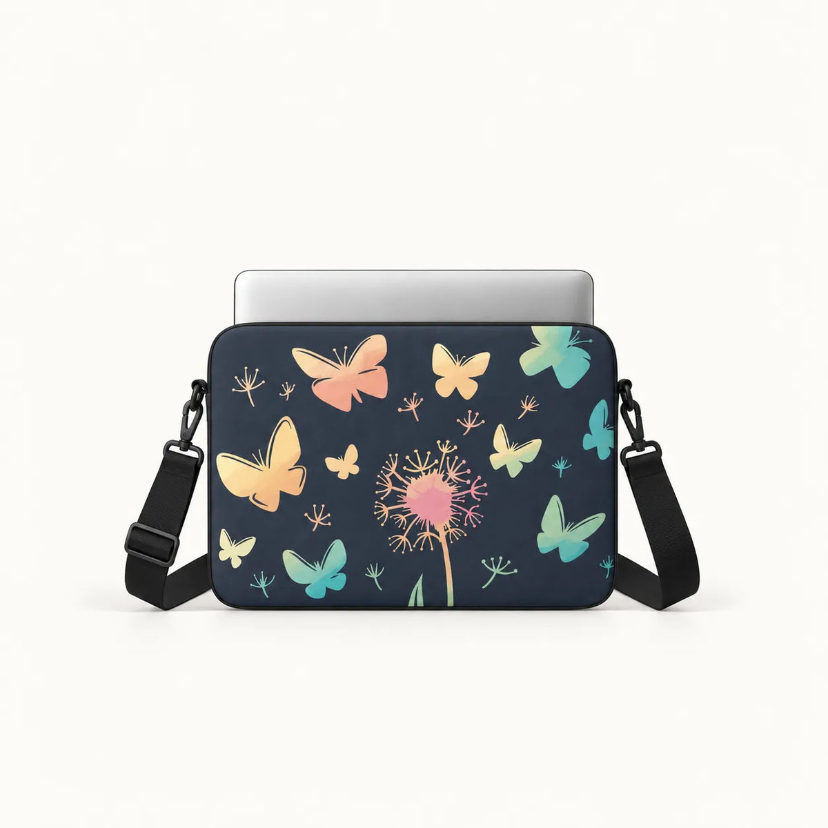 A navy blue laptop sleeve with a colorful butterfly and dandelion print, shown with a silver laptop inside and a black shoulder strap on a clean white background.