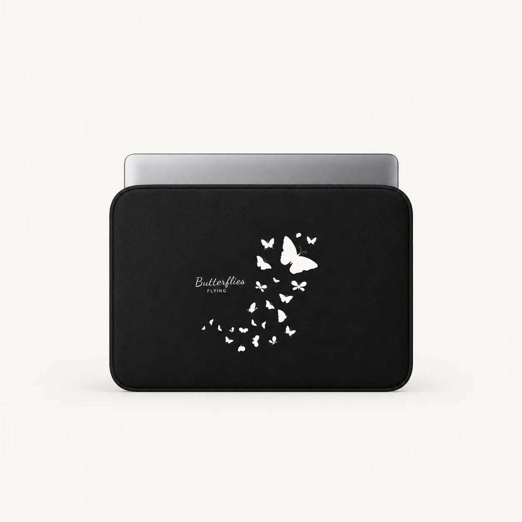 Black padded laptop sleeve featuring a white flying butterflies print with a laptop partially inserted inside.