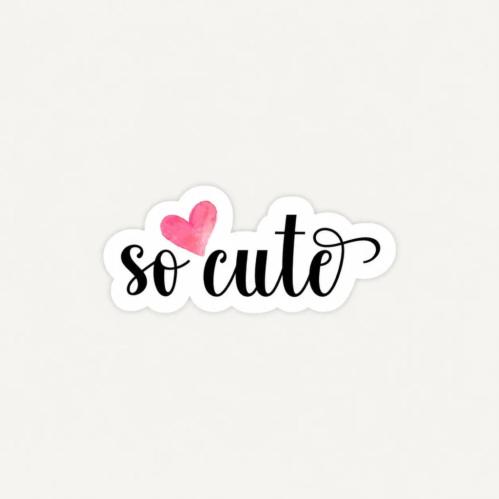 A die-cut sticker with the phrase 'so cute' in black cursive script, featuring a pink watercolor heart above the 'co', shown on a light off-white background.
