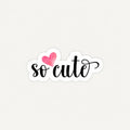 A die-cut sticker with the phrase 'so cute' in black cursive script, featuring a pink watercolor heart above the 'co', shown on a light off-white background.