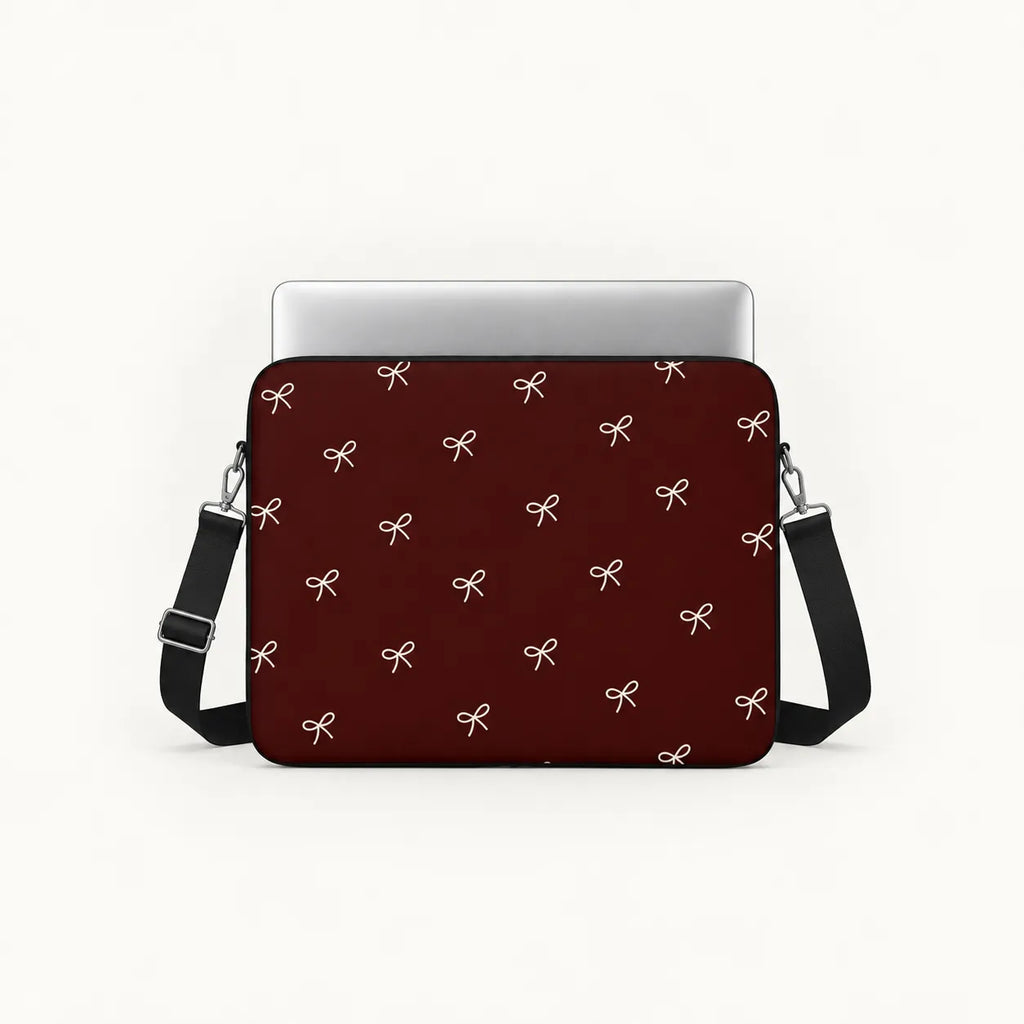 Minimalist white line art ribbon bows pattern on a deep burgundy padded laptop sleeve by SLEEVER