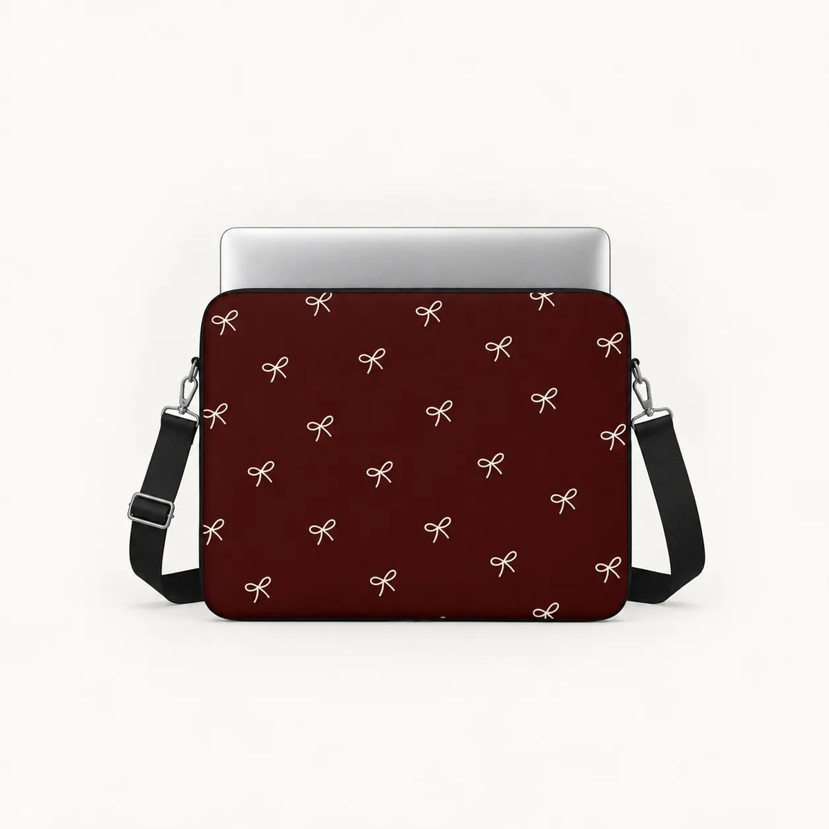 Minimalist white line art ribbon bows pattern on a deep burgundy padded laptop sleeve by SLEEVER