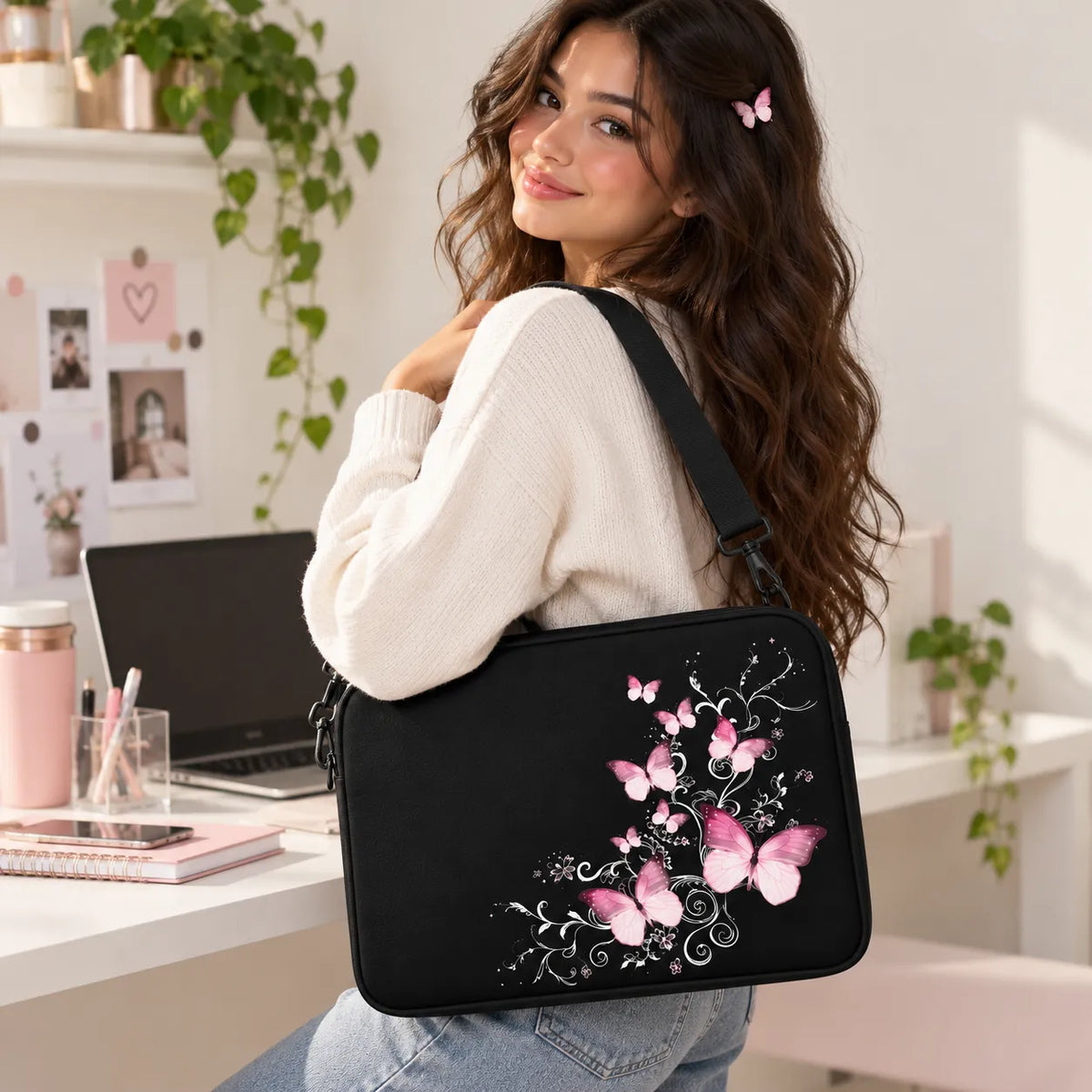 Elegantly glowing pink butterflies floating over silvery swirl vines on a black padded laptop sleeve by SLEEVER