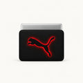 A black laptop sleeve featuring the Puma leaping cat logo in black with a glowing red outline, shown with a silver laptop partially inserted, on a clean white background.