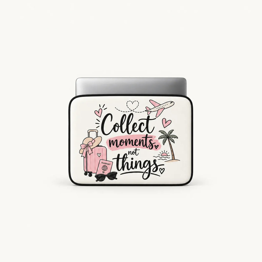 A white laptop sleeve with black trim and a printed graphic featuring the phrase 'Collect moments, not things' in black and pink script, along with illustrations of a pink suitcase, palm tree, airplane, sunglasses, and hearts. A silver laptop is partially inserted at the top, shown on a light gray background.