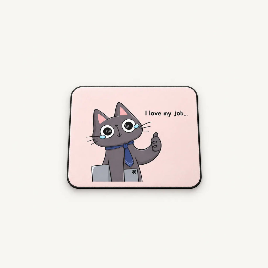 A square mousepad with rounded corners featuring a cartoon gray cat wearing glasses and a blue tie, holding a laptop and giving a thumbs-up, with the text 'I love my job.