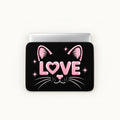 Cute black cat face illustration with pink glittery LOVE letters, ears, nose, and whiskers on a black padded laptop sleeve by SLEEVER