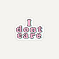 A die-cut sticker with the phrase 'I dont care' in pink bubble letters outlined in black, with a white border and a subtle light blue shadow, centered on a light gray background.