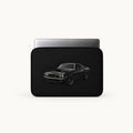 A black laptop sleeve featuring a graphic print of a black muscle car, shown with a silver laptop inside on a light off-white background.