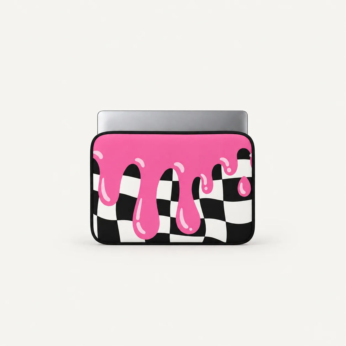 A laptop sleeve featuring a black and white checkered pattern with bright pink dripping paint on top, shown on a light gray background.