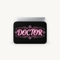 Glowing pink neon DOCTOR typography with floral flourishes on a black padded laptop sleeve by SLEEVER   