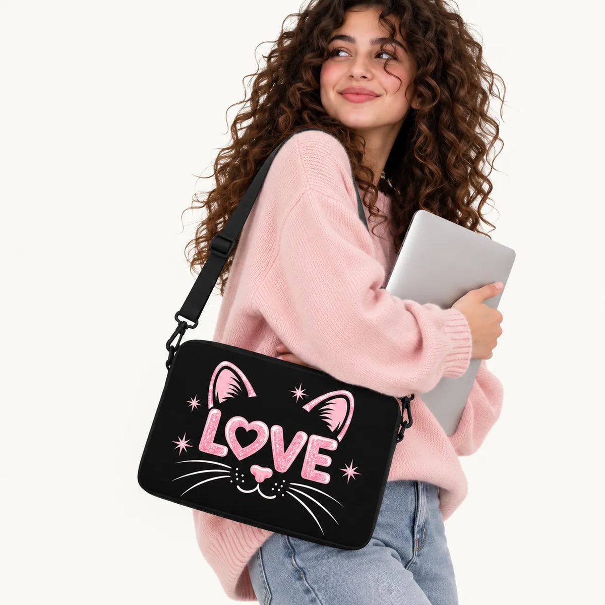 Cute black cat face illustration with pink glittery LOVE letters, ears, nose, and whiskers on a black padded laptop sleeve by SLEEVER