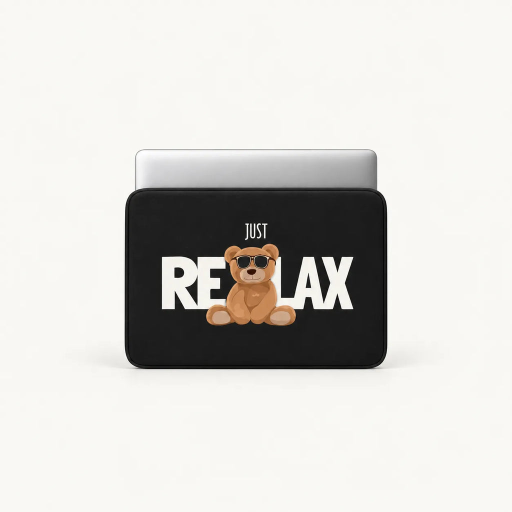 Cool teddy bear wearing sunglasses sitting with JUST RELAX typography on a black padded laptop sleeve by SLEEVER