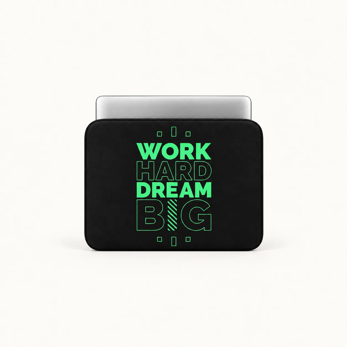 A black laptop sleeve with a silver laptop partially inserted, featuring the motivational text 'WORK HARD DREAM BIG' in bright green on the front, set against a clean off-white background.