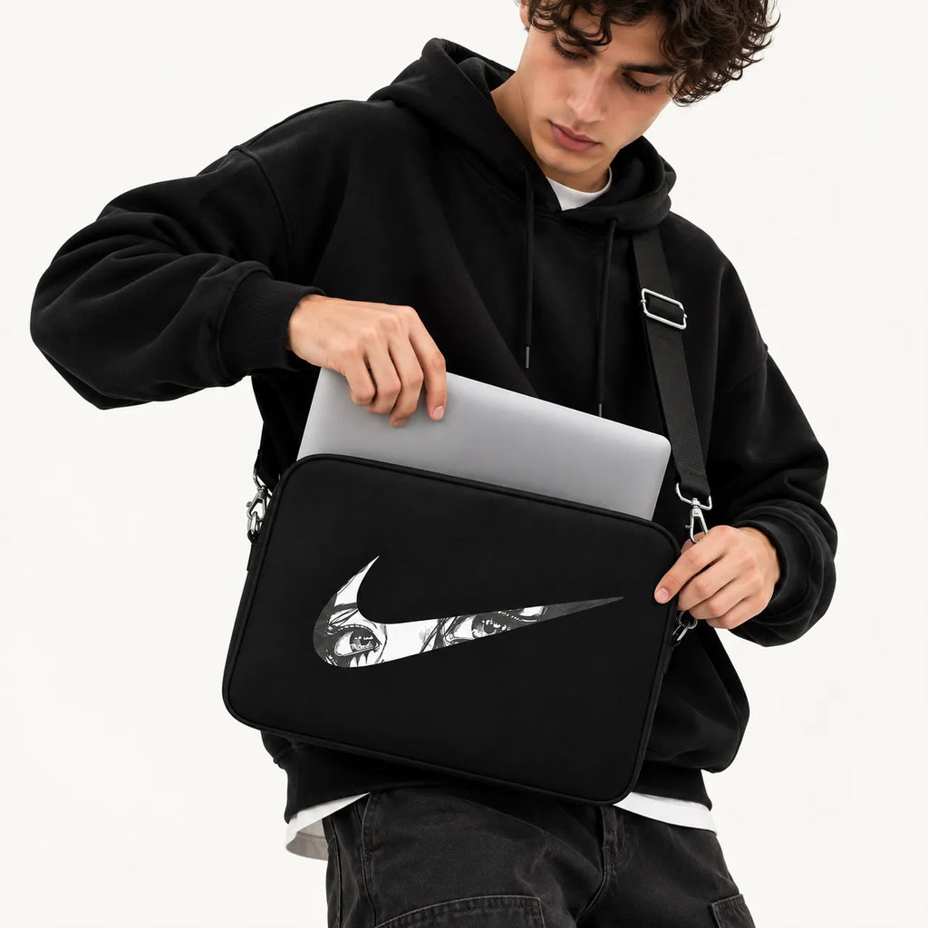 Monochrome anime eyes illustration inside a athletic swoosh logo on a black padded laptop sleeve by SLEEVER