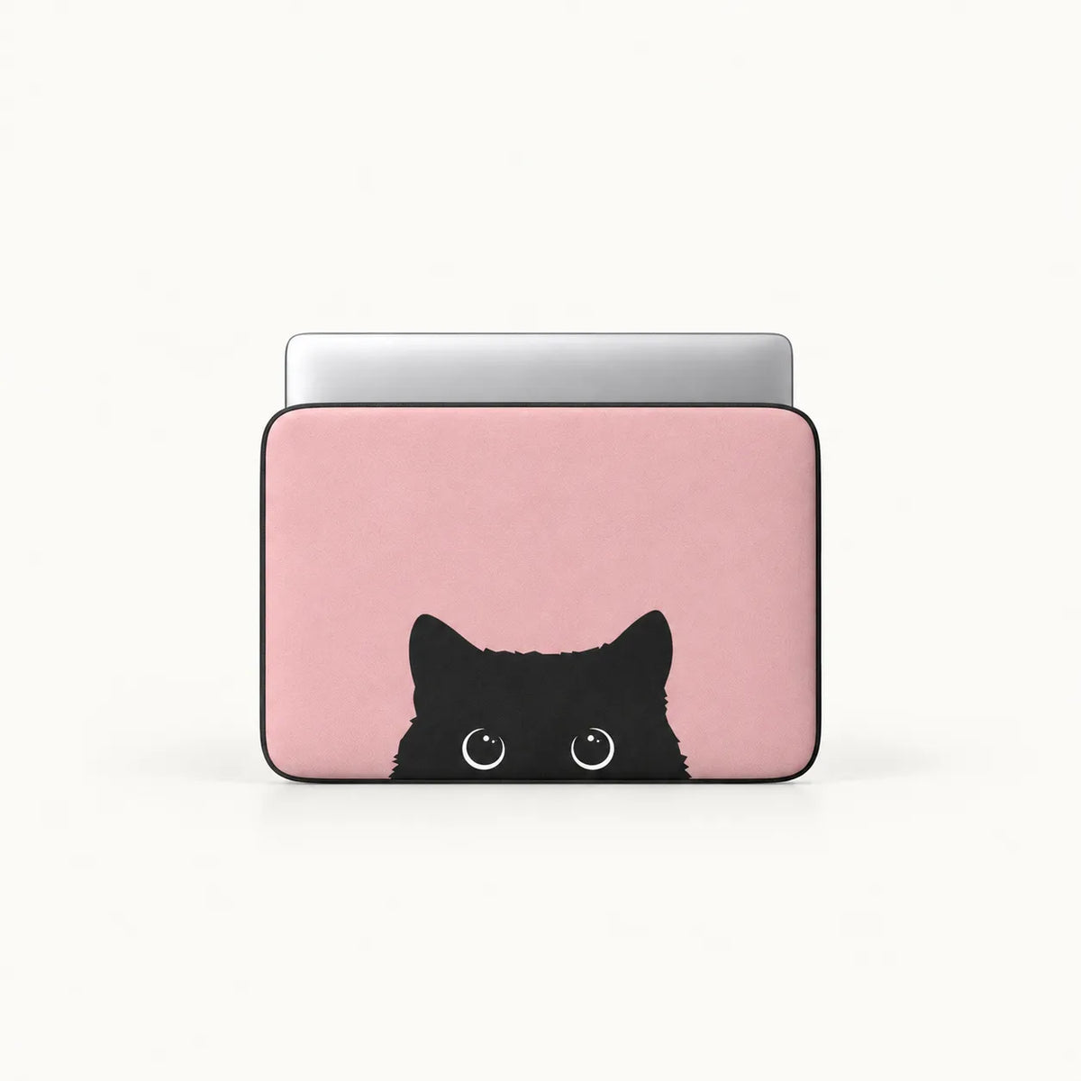 Cute black cat peeking from the bottom on a dusty pink padded laptop sleeve by SLEEVER