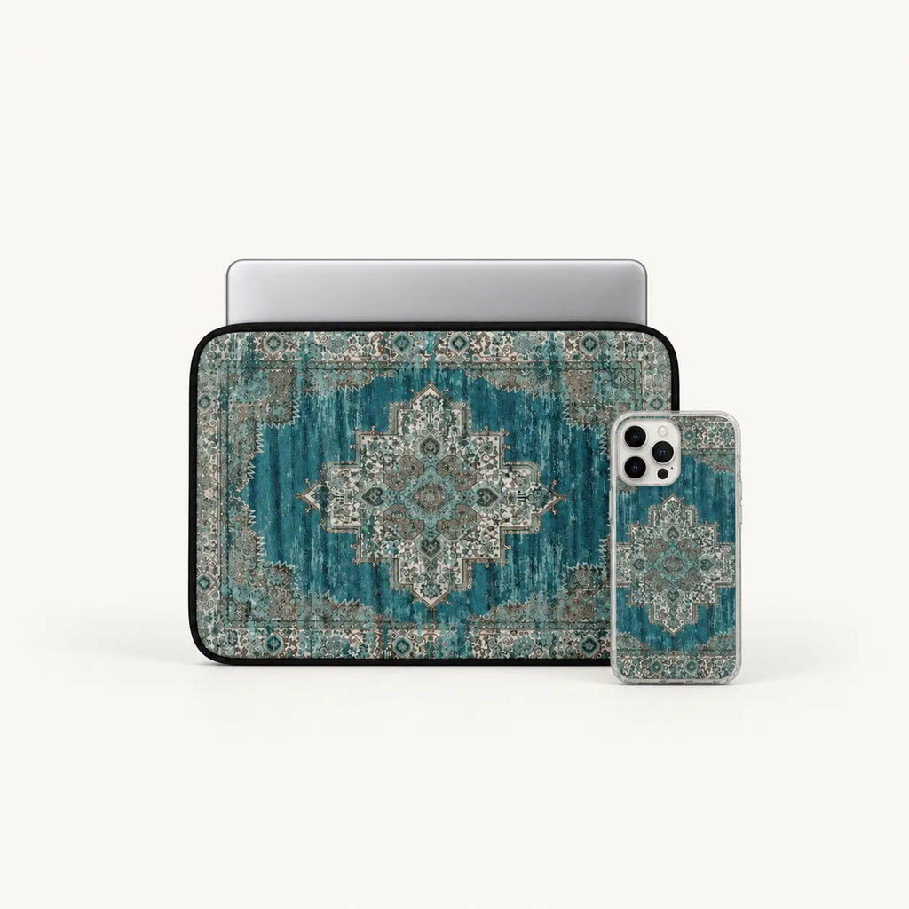 A laptop sleeve and a smartphone case, both decorated with a distressed teal and beige vintage-style medallion pattern, displayed on a clean off-white background.