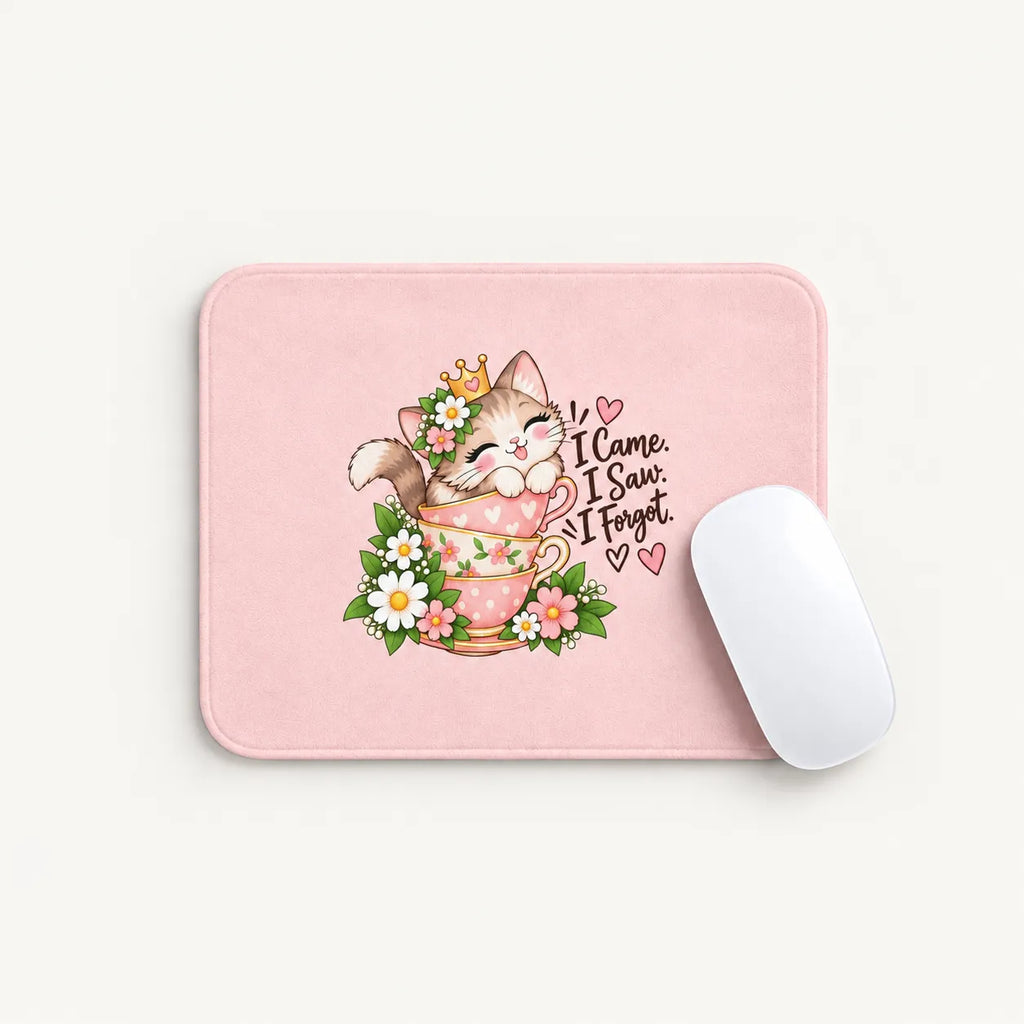A pink rectangular mouse pad with rounded corners featuring a cute illustration of a kitten in a teacup surrounded by flowers and the text 'I Came. I Saw.