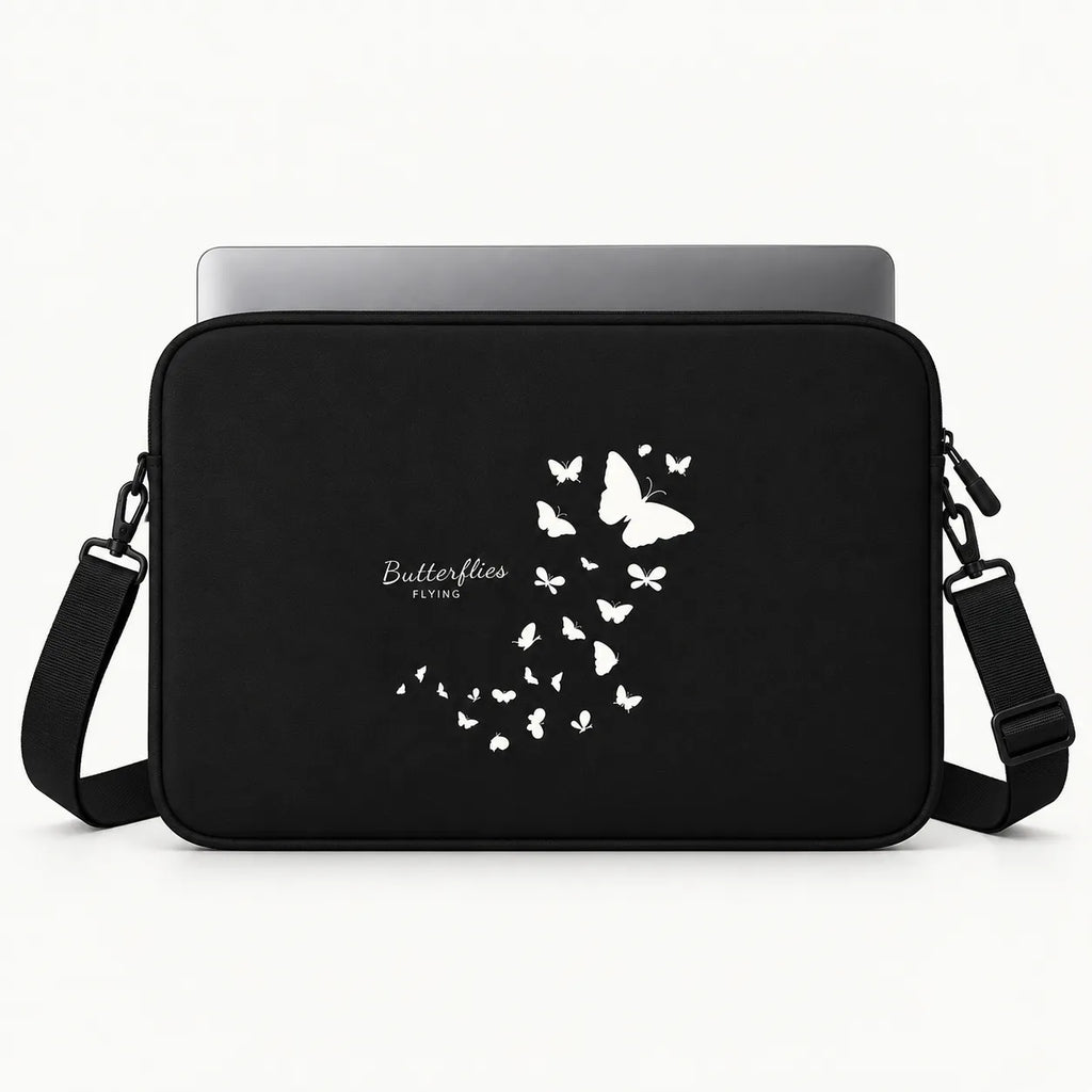 Black laptop sleeve with a white butterfly graphic and 'Butterflies Flying' text, shown with a silver laptop on a white background.