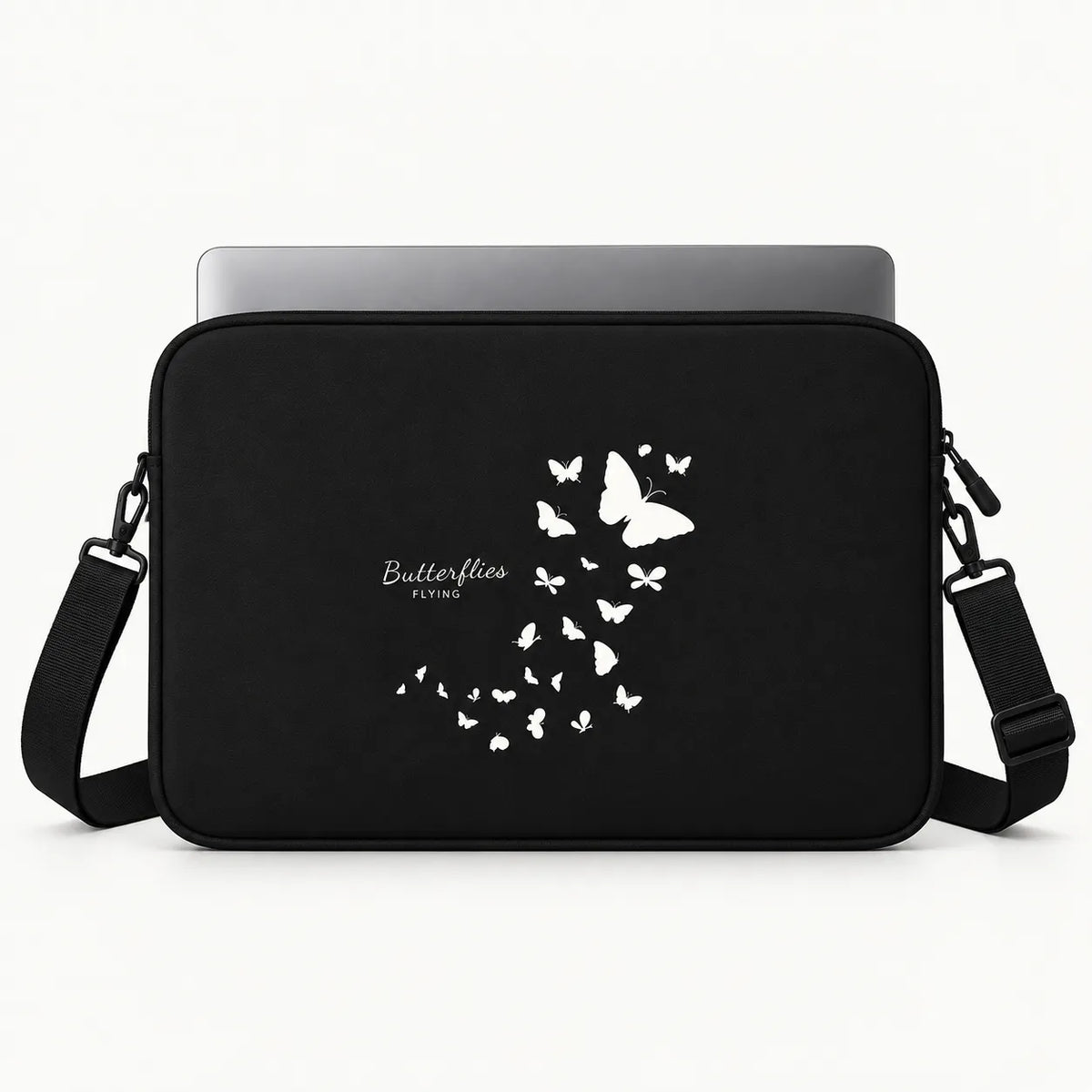 Black laptop sleeve with a white butterfly graphic and 'Butterflies Flying' text, shown with a silver laptop on a white background.