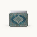 Vintage oriental Persian carpet rug pattern in teal and beige on a padded laptop sleeve by SLEEVER