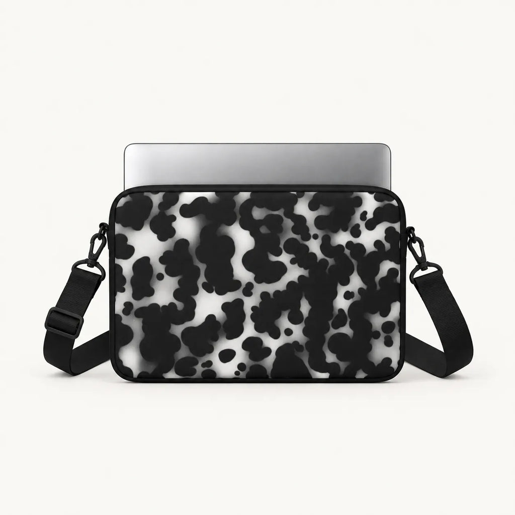Monochrome black and white dalmatian spot print padded laptop sleeve by SLEEVER