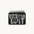 A black laptop sleeve with a motivational graphic reading 'YOU CAN DO IT' in distressed gray and black lettering, shown on a light gray background with a silver laptop partially visible inside.