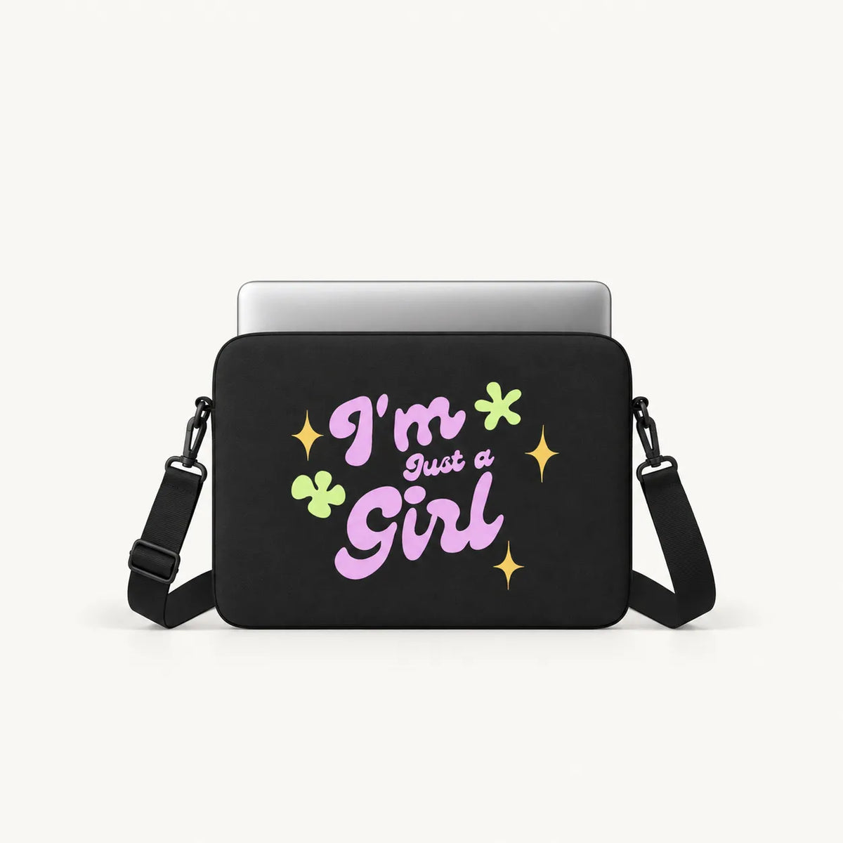 Groovy typography reading I'm Just a Girl in pink with yellow sparkles and green flowers on a black padded laptop sleeve by SLEEVER