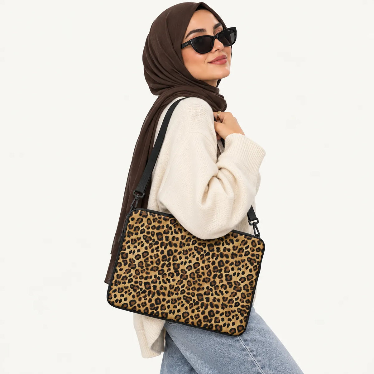 Classic leopard print pattern in gold and brown on a padded laptop sleeve by SLEEVER