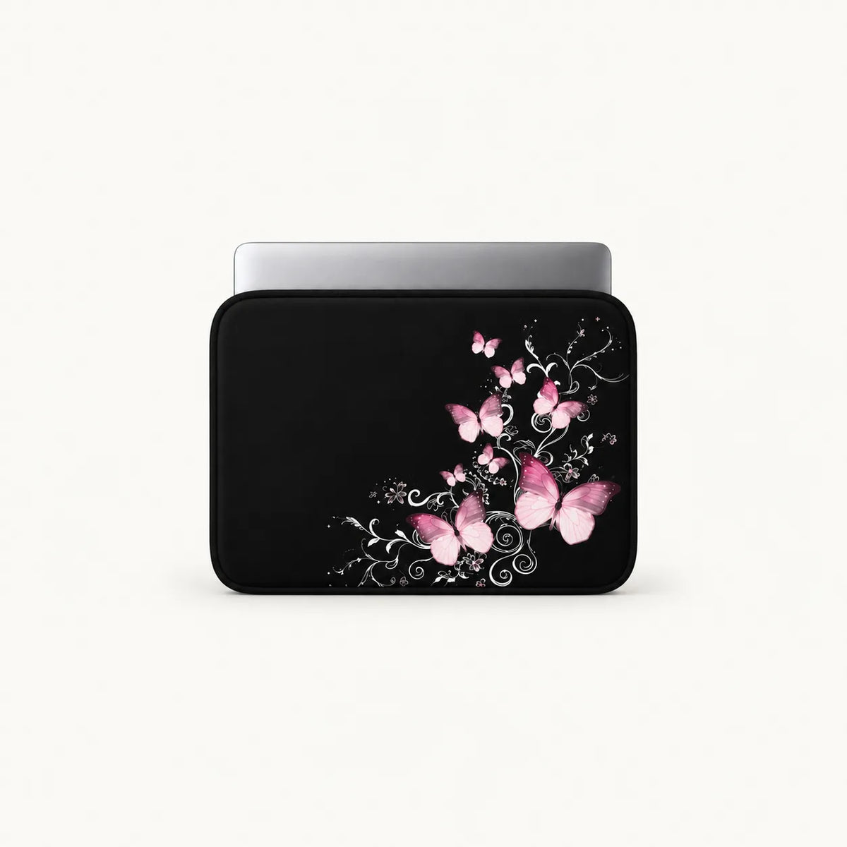 Elegantly glowing pink butterflies floating over silvery swirl vines on a black padded laptop sleeve by SLEEVER