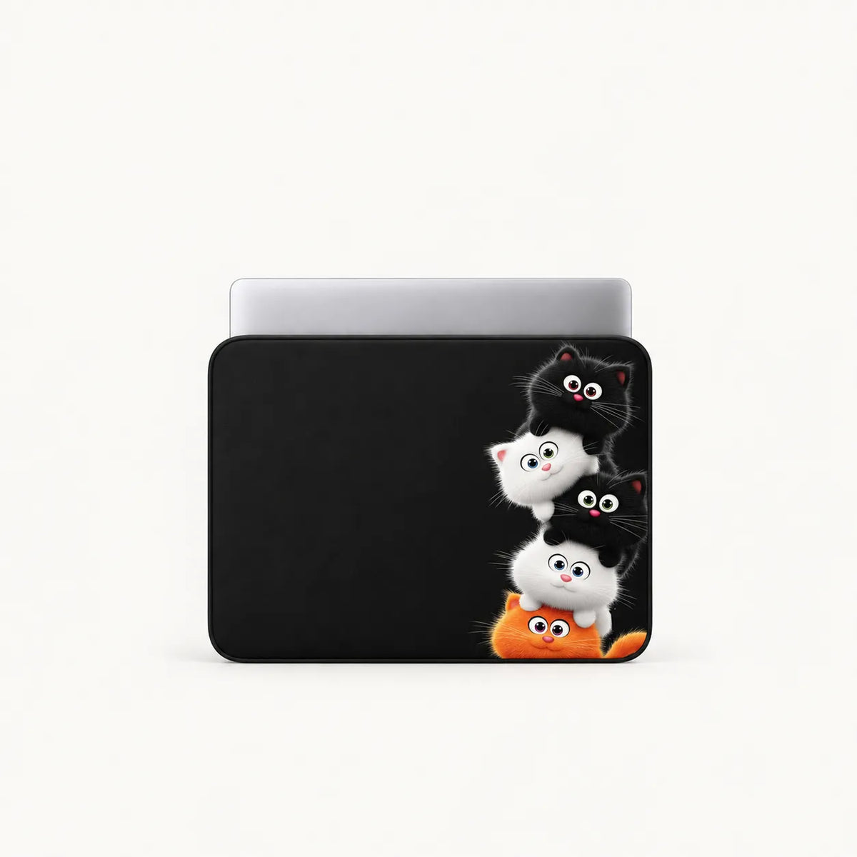 Stacked cute cartoon black, white, and orange kittens on a black padded laptop sleeve by SLEEVER